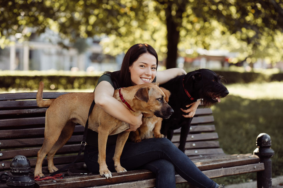 Happy pet owner after reuniting with lost pets